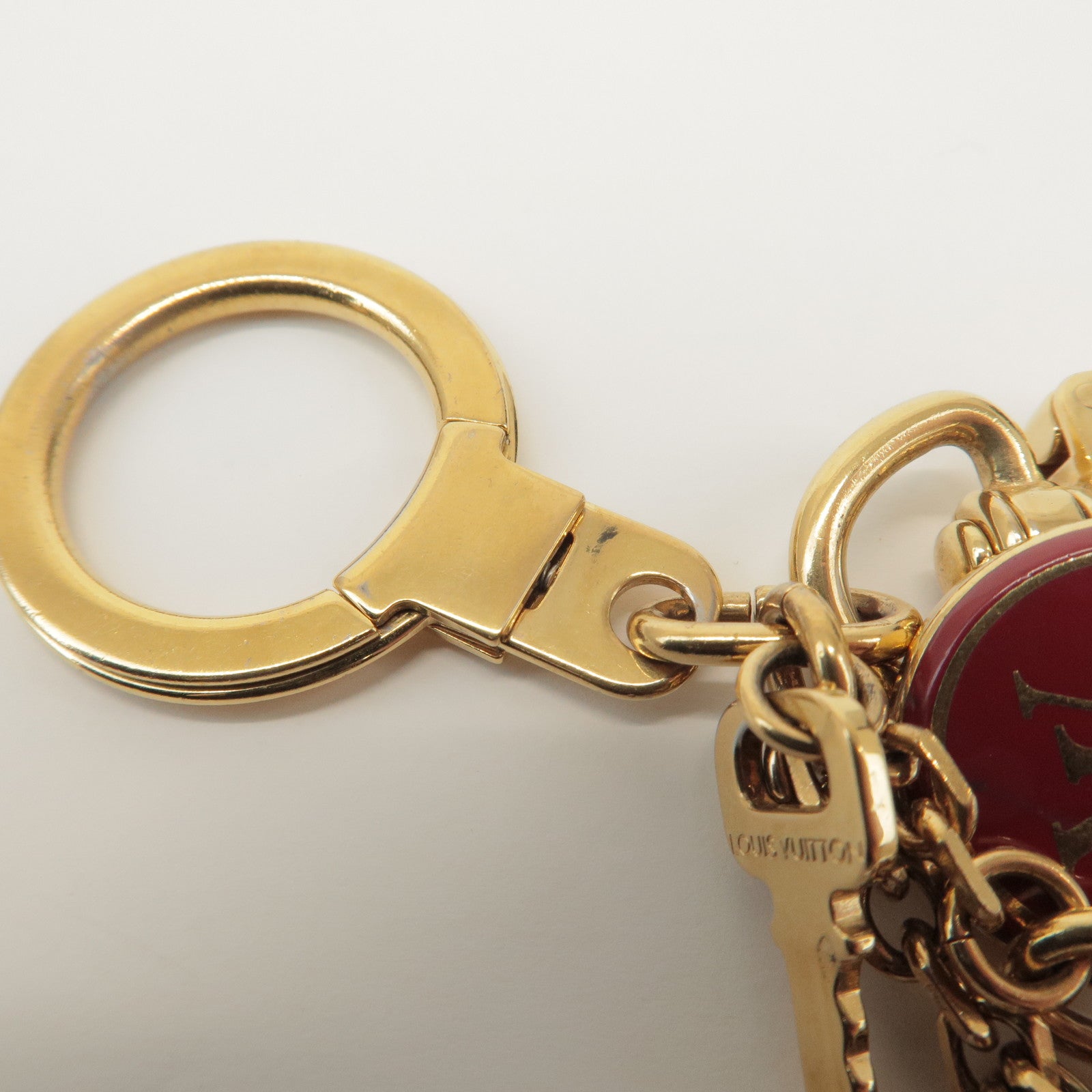 Louis Vuitton Porte Cles Pompille Metal Bag Charm Gold Red M91928