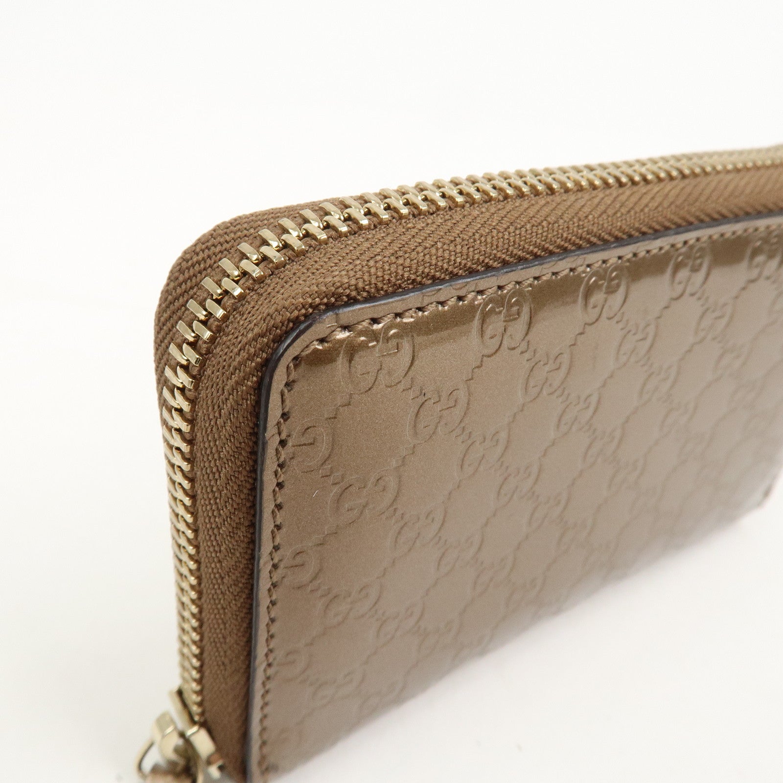 GUCCI Micro Guccissima Leather Zippy Wallet Card Case Bronze 255452