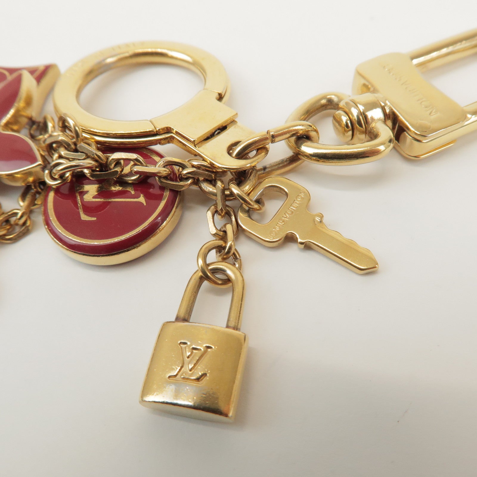 Louis Vuitton Porte Cles Pompille Metal Bag Charm Gold Red M91928