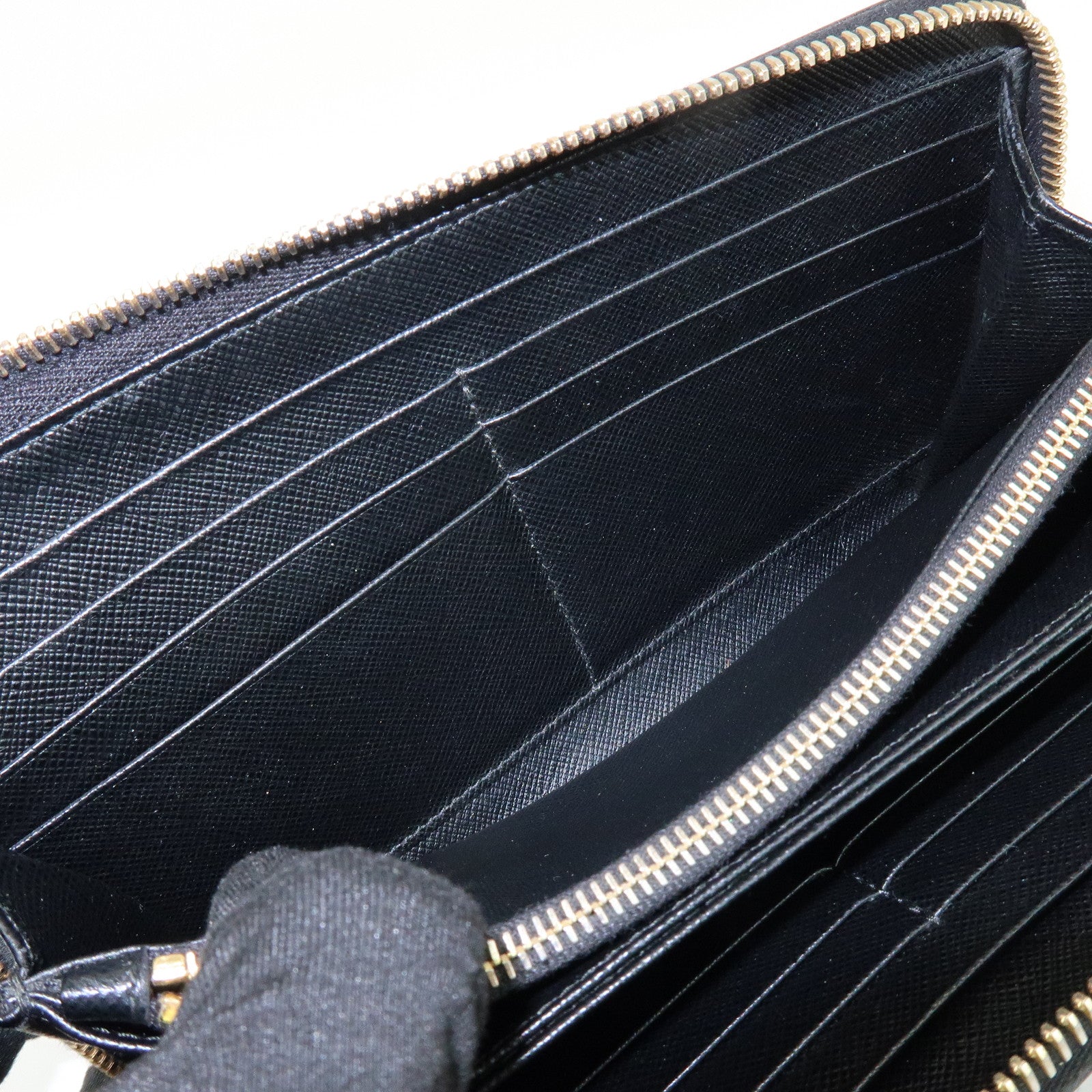 PRADA Saffiano Leather Ribbon Round Zippy Wallet Black 1M0506