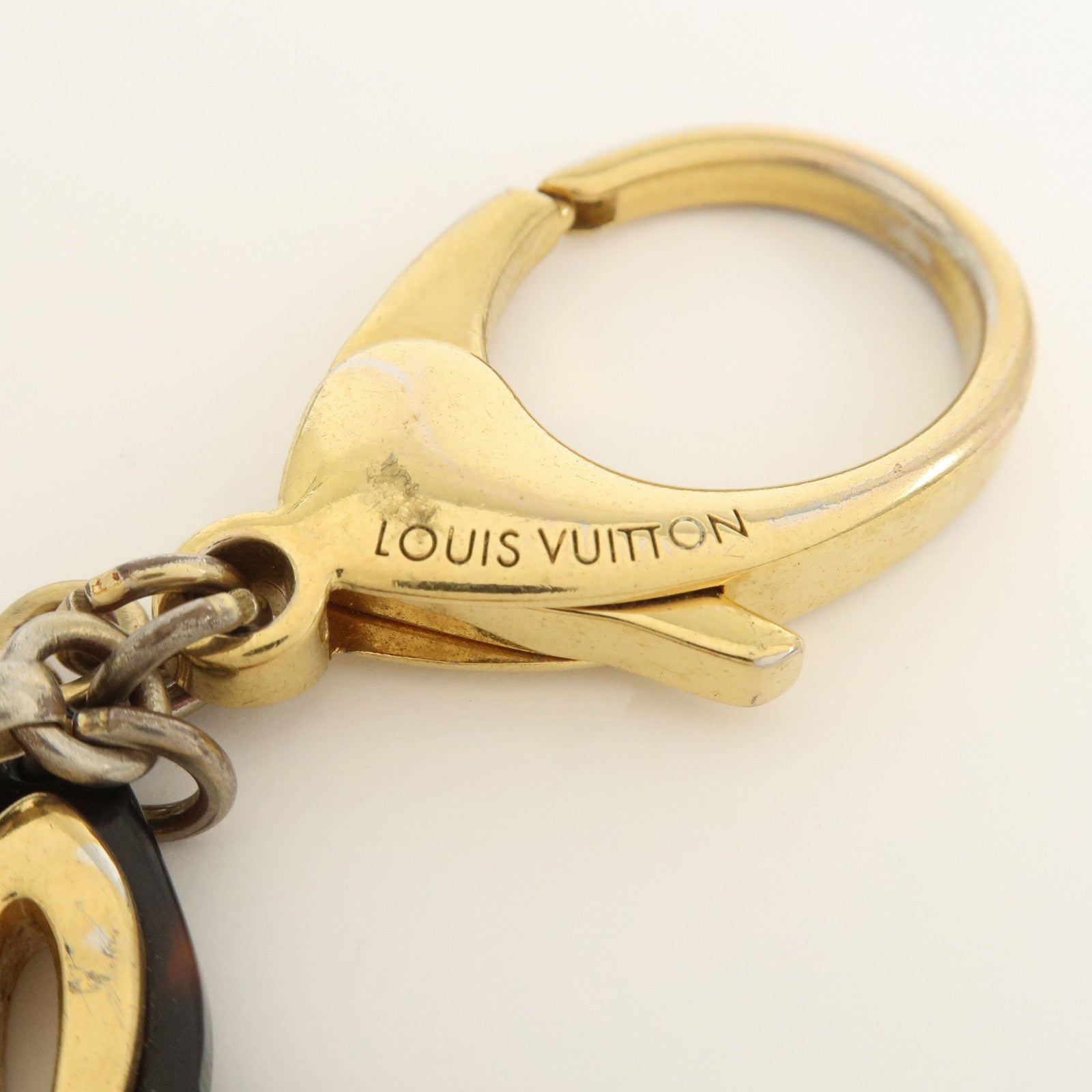 Louis Vuitton Bijou Sac Insolence Bag Charm Gold Brown M65087