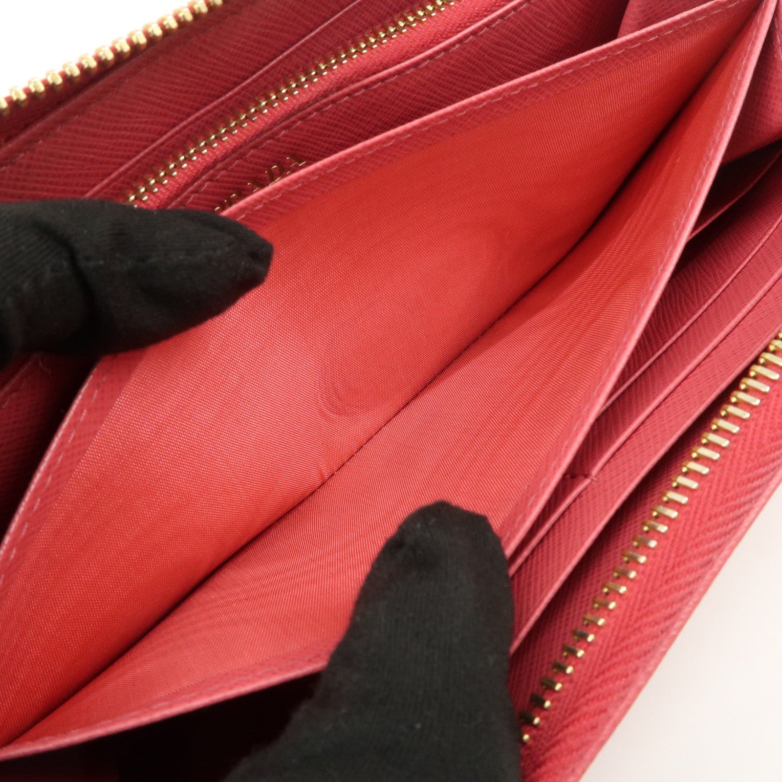 PRADA Logo Saffiano Leather Round Zippy Long Wallet Pink 1M0506