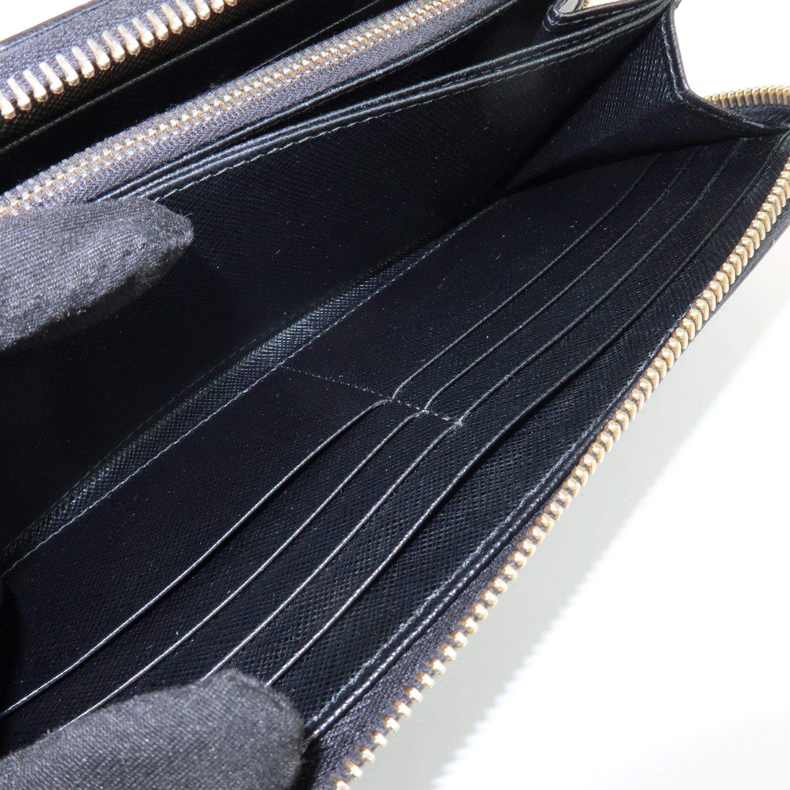 PRADA Saffiano Leather Ribbon Round Zippy Wallet Black 1M0506