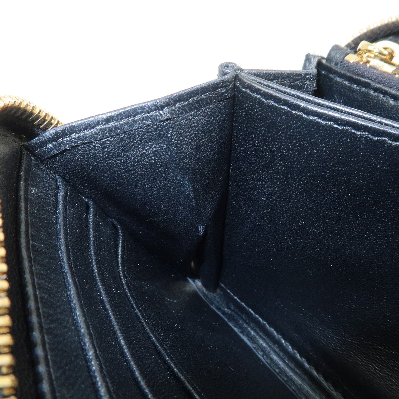 MIU MIU Logo Matelasse Nappa Leather Zippy Long Wallet Black