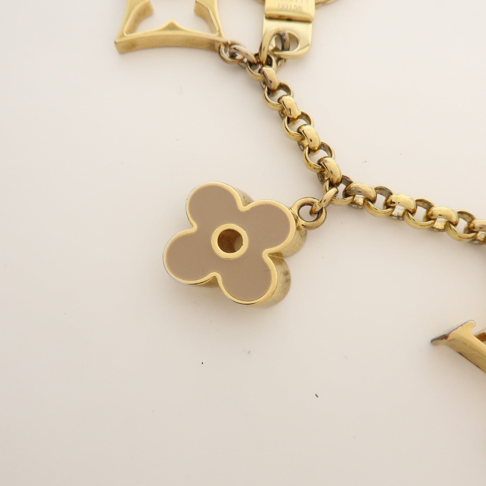 Louis Vuitton Fleur de Monogram Bag Charm Key Chain Gold M65111
