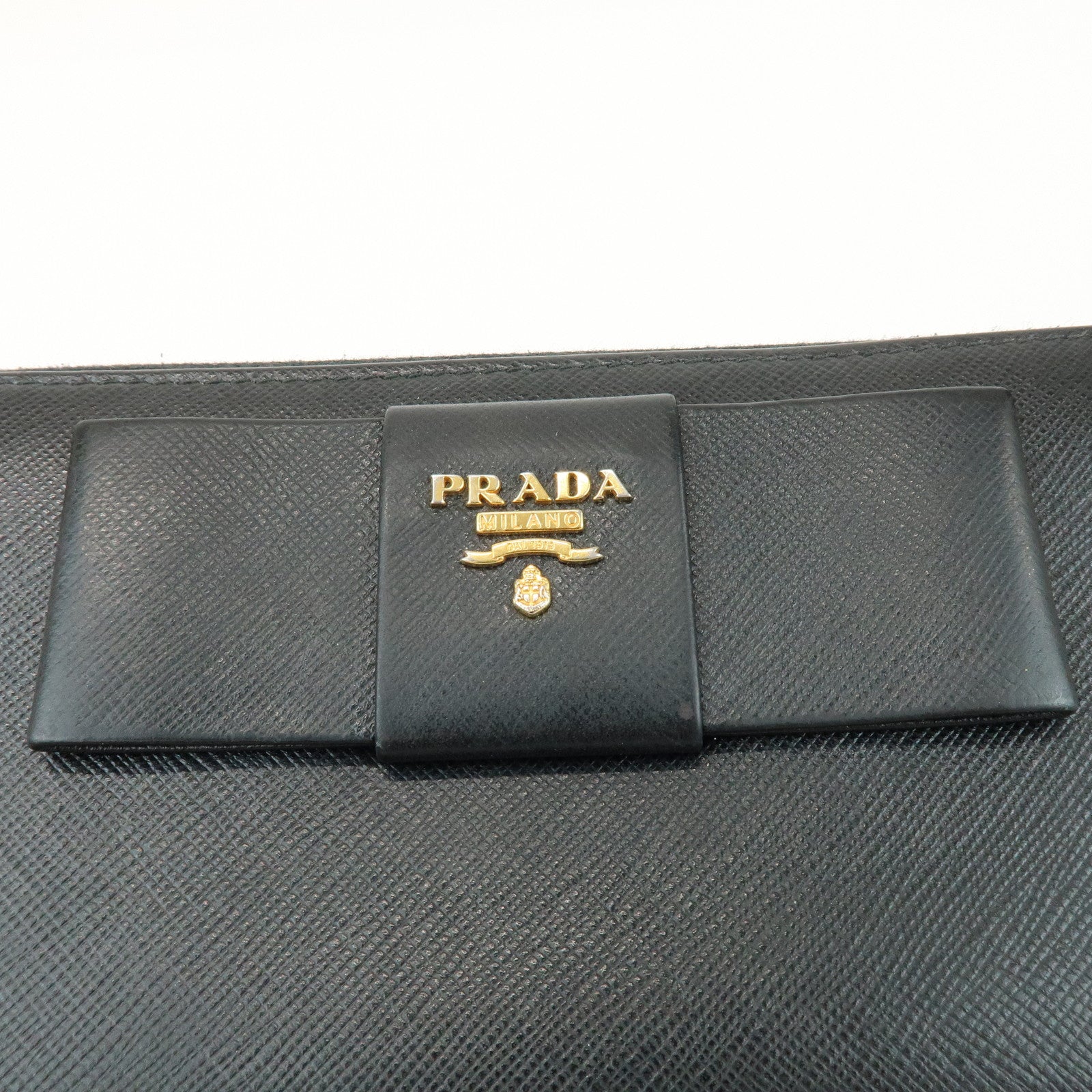 PRADA Saffiano Leather Ribbon Round Zippy Wallet Black 1M0506