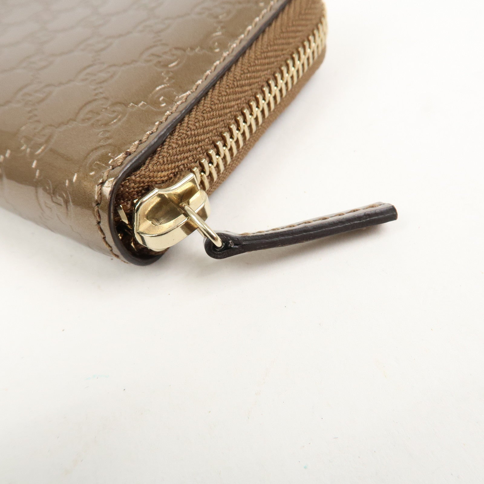 GUCCI Micro Guccissima Leather Zippy Wallet Card Case Bronze 255452