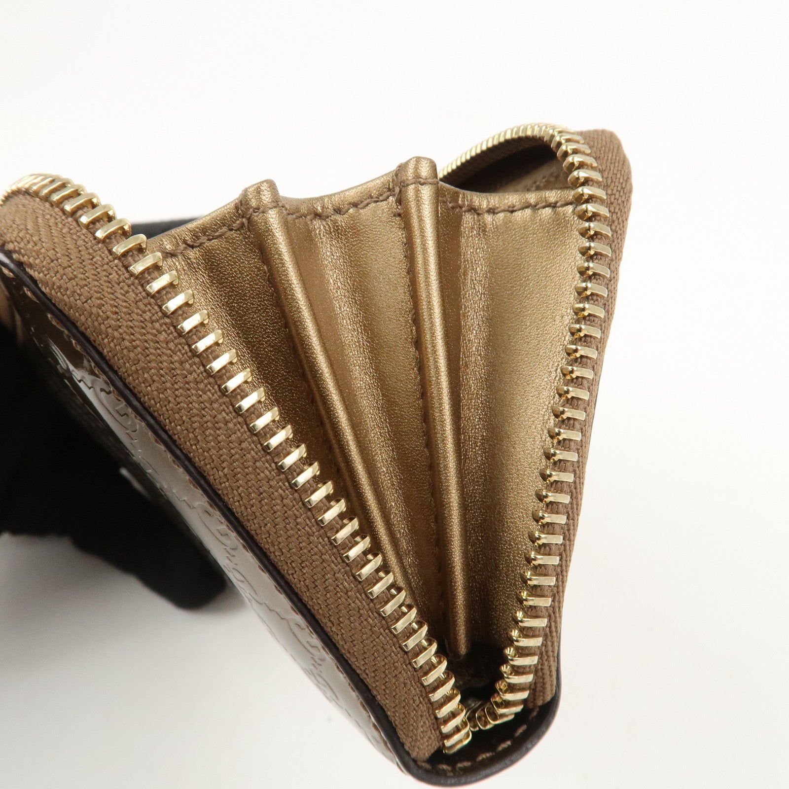 GUCCI Micro Guccissima Leather Zippy Wallet Card Case Bronze 255452