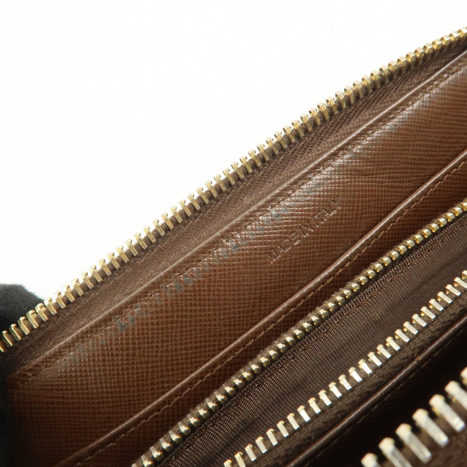 PRADA Triangle Logo Saffiano Leather Round Zippy Wallet 1M0506