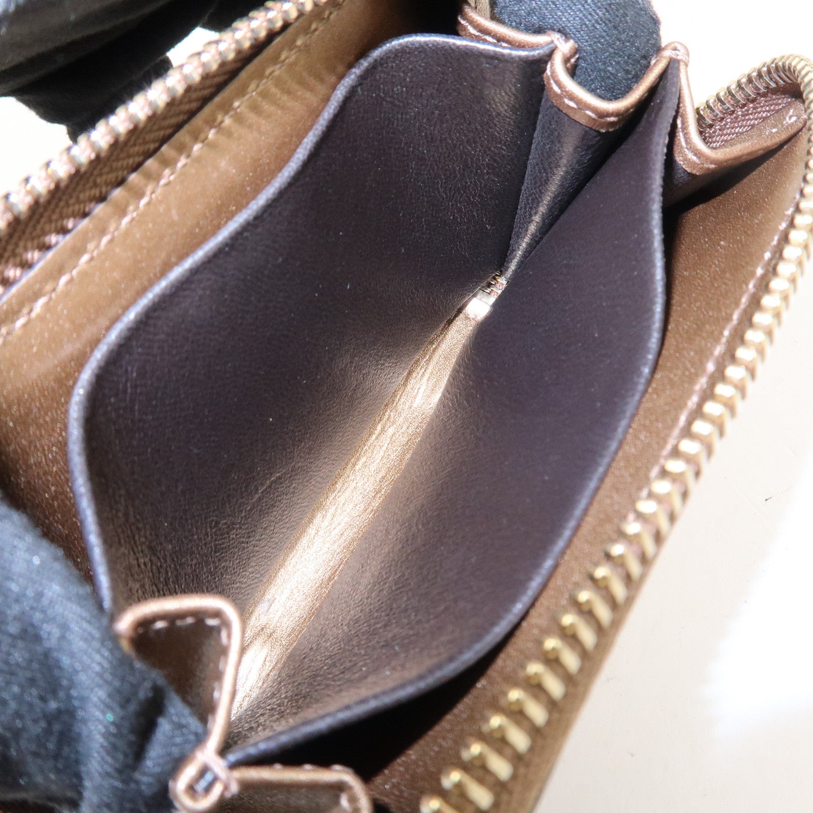 GUCCI Micro Guccissima Leather Zippy Wallet Card Case Bronze 255452