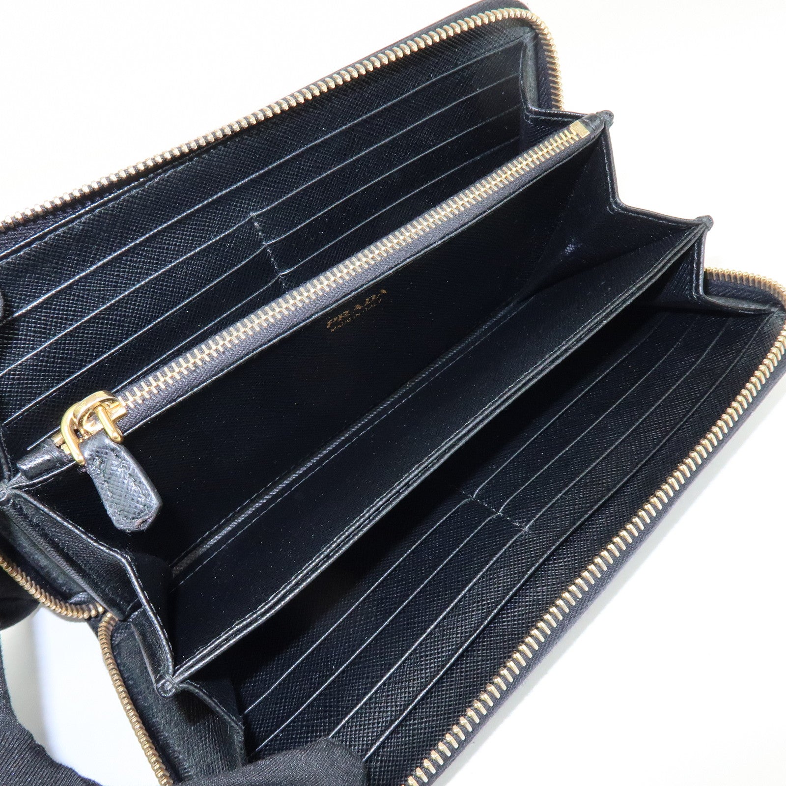 PRADA Saffiano Leather Ribbon Round Zippy Wallet Black 1M0506