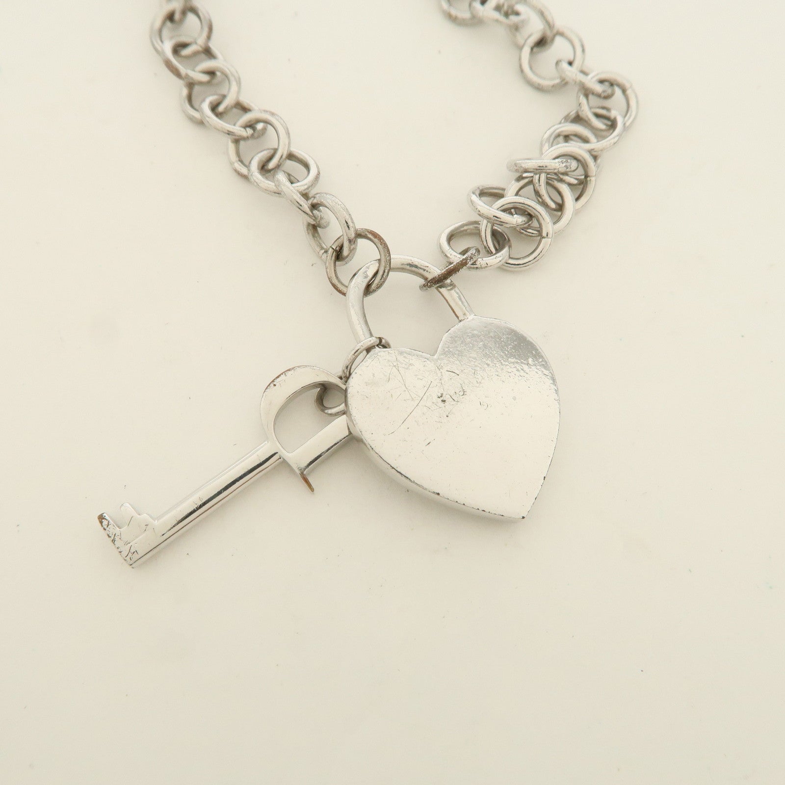 Christian Dior Logo Heart Lock & Key Pendant Metal Necklace Silver