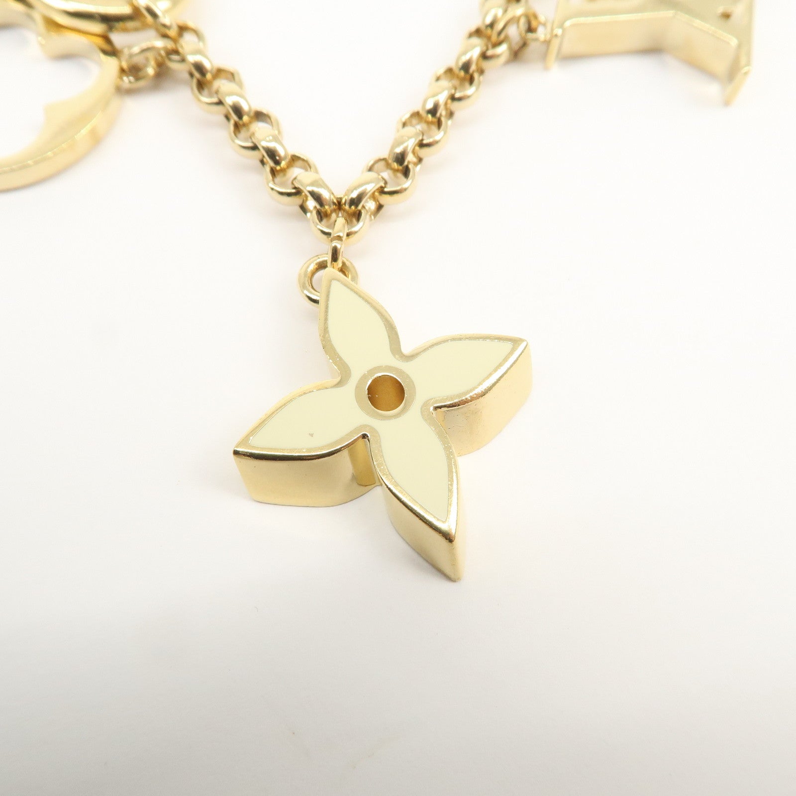 Louis Vuitton Fleur de Monogram Bag Charm Key Chain Gold M65111