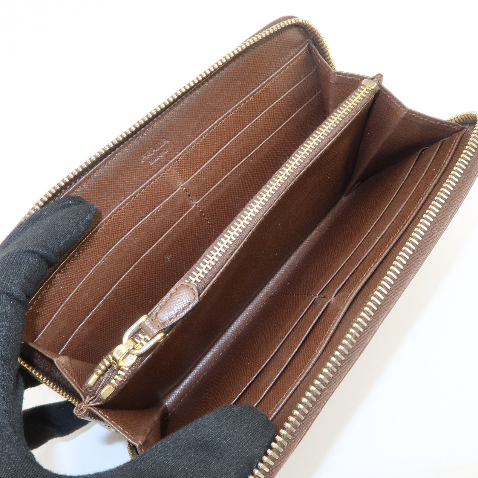 PRADA Triangle Logo Saffiano Leather Round Zippy Wallet 1M0506