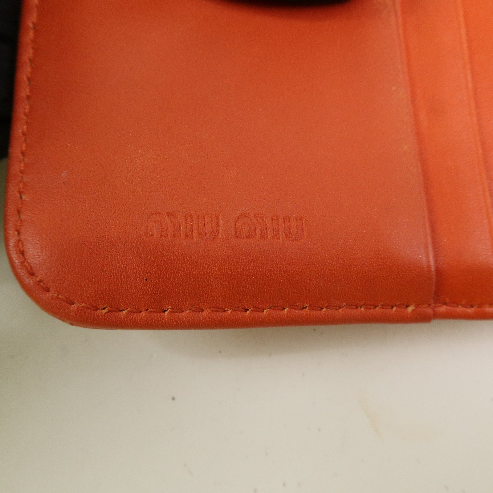 MIU MIU Leather Bi-Fold Wallet Compact Wallet Orange Gold Hardware Used