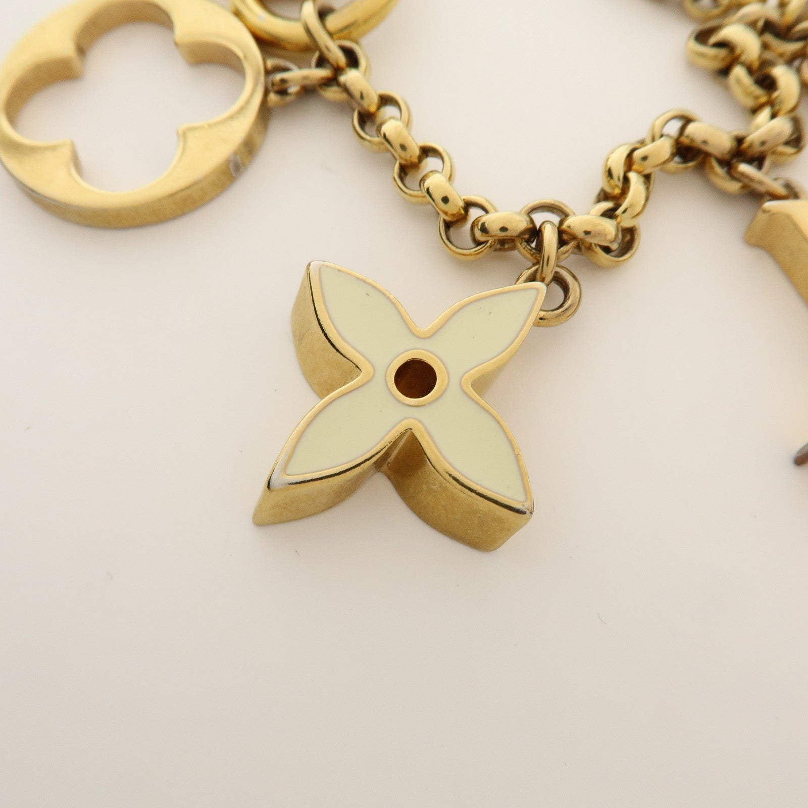 Louis Vuitton Fleur de Monogram Bag Charm Key Chain Gold M65111