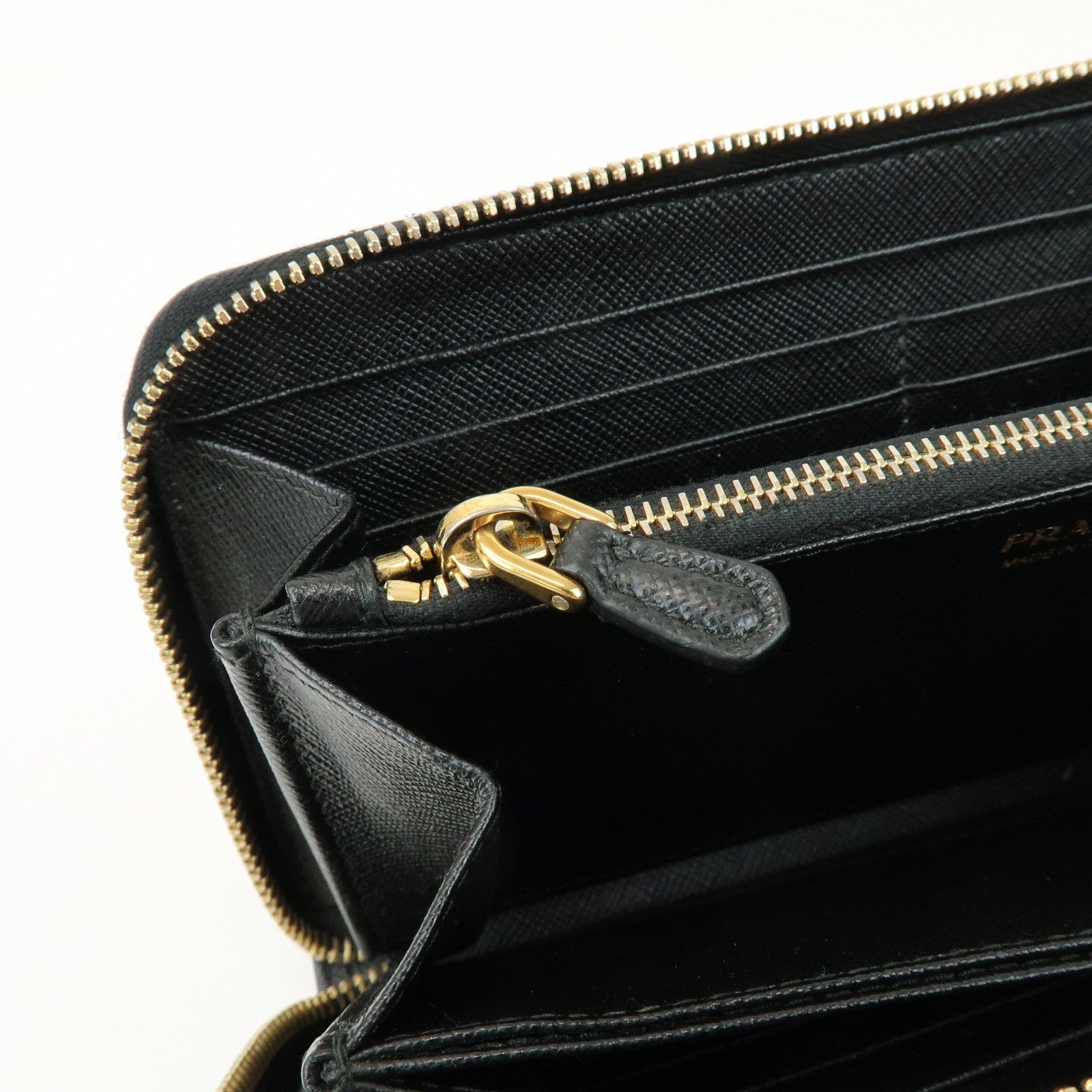PRADA Saffiano Leather Ribbon Round Zippy Wallet Black 1M0506
