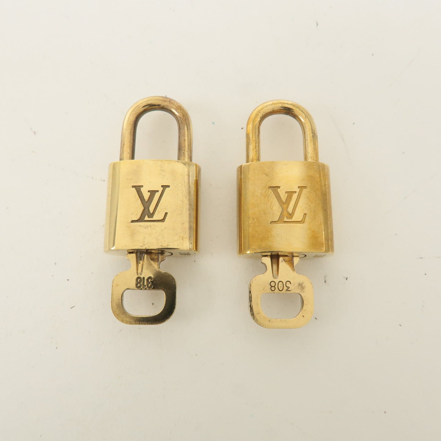 Louis Vuitton Set of 10 Lock & Key Cadena Key Lock Gold