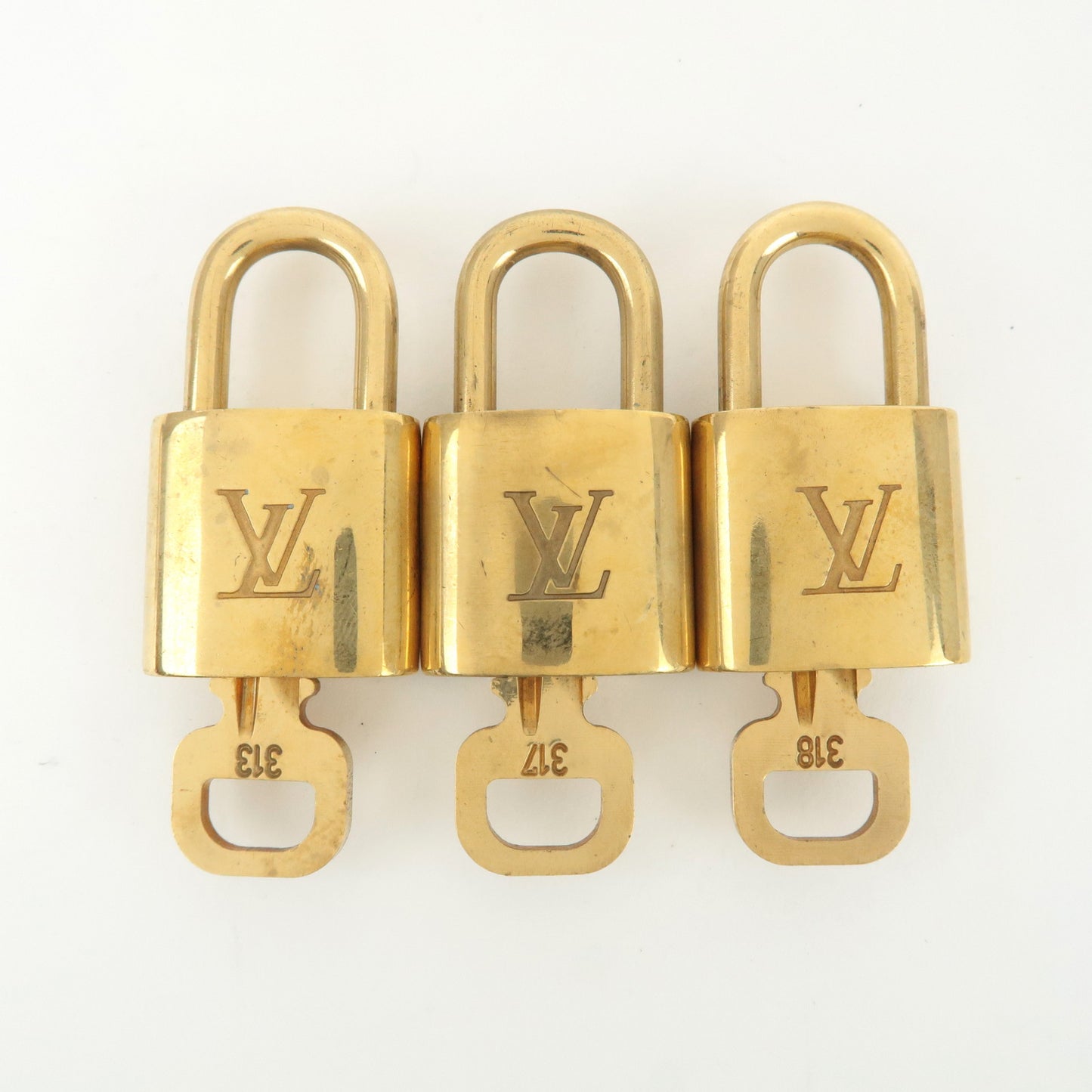 Louis Vuitton Set of 10 Lock & Key Cadena Key Lock Gold