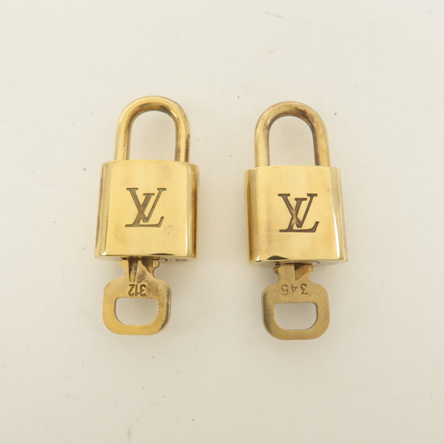 Louis Vuitton Set of 10 Lock & Key Cadena Key Lock Gold