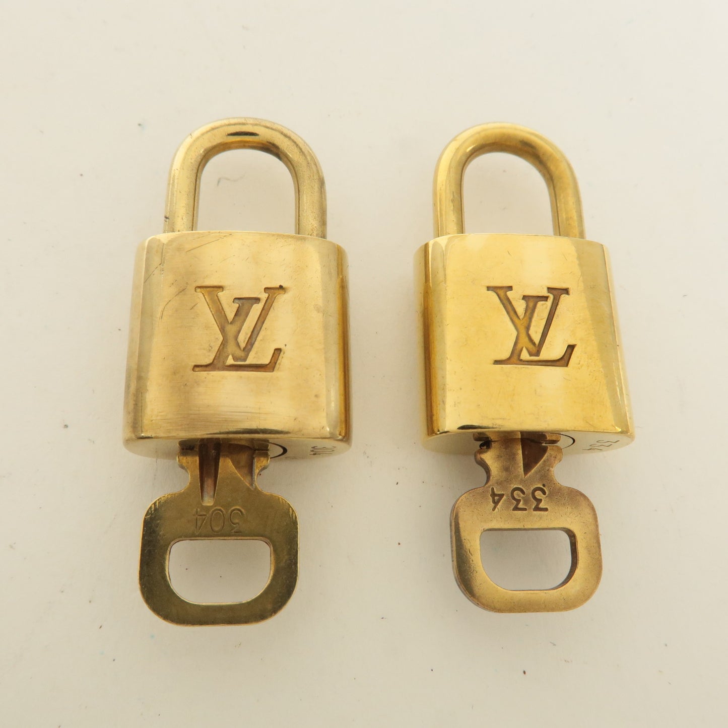 Louis Vuitton Set of 10 Lock & Key Cadena Key Lock Gold