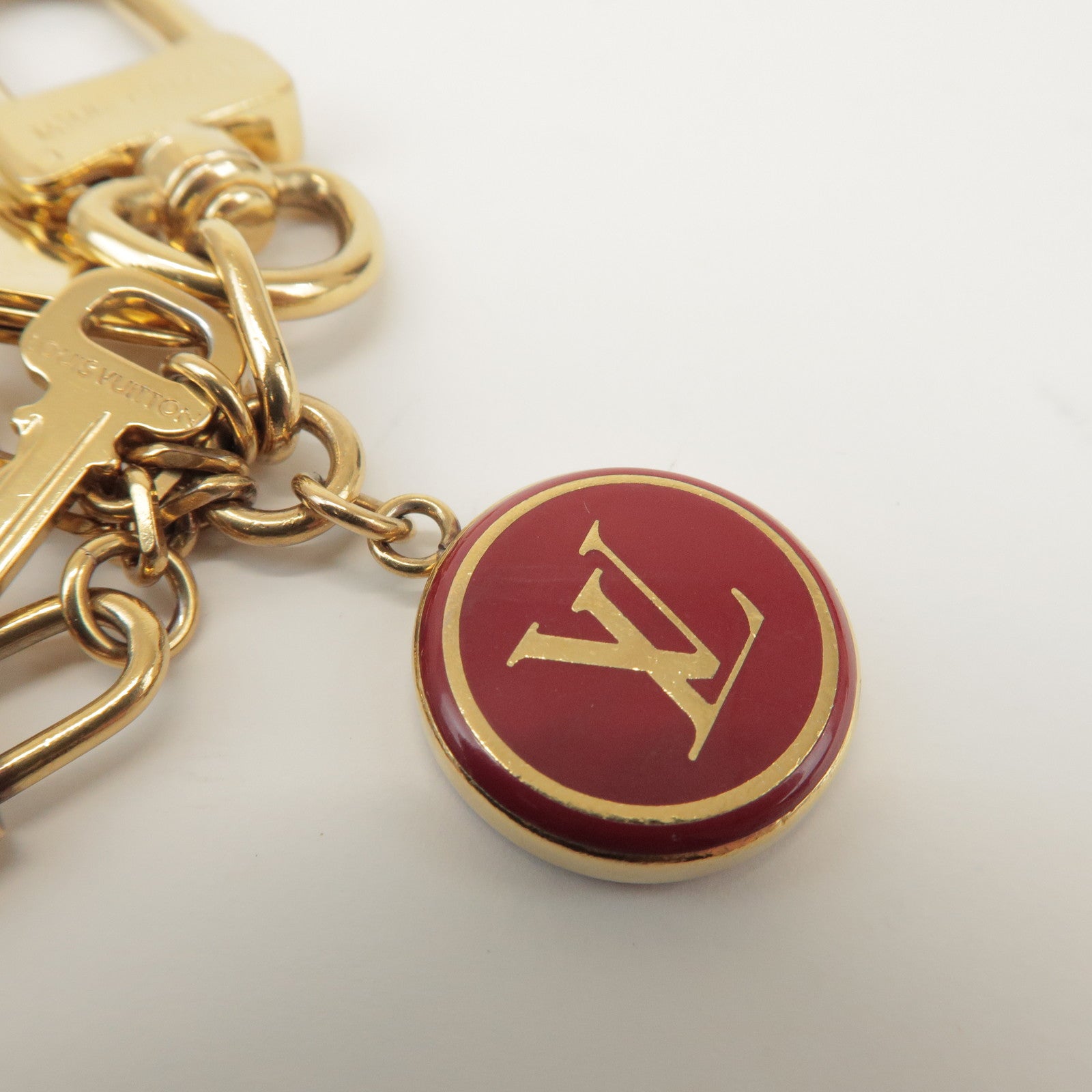 Louis Vuitton Porte Cles Pompille Metal Bag Charm Gold Red M91928