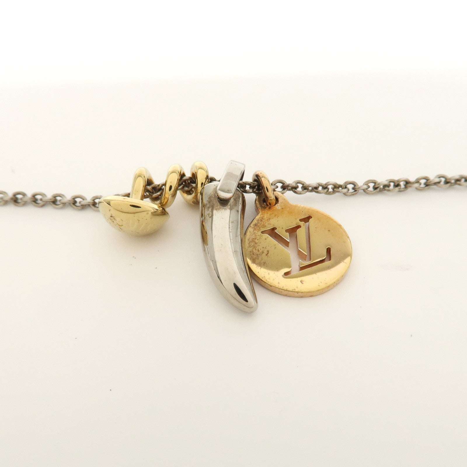 Louis Vuitton Metal LV Safari Charms Necklace Silver Gold M68106
