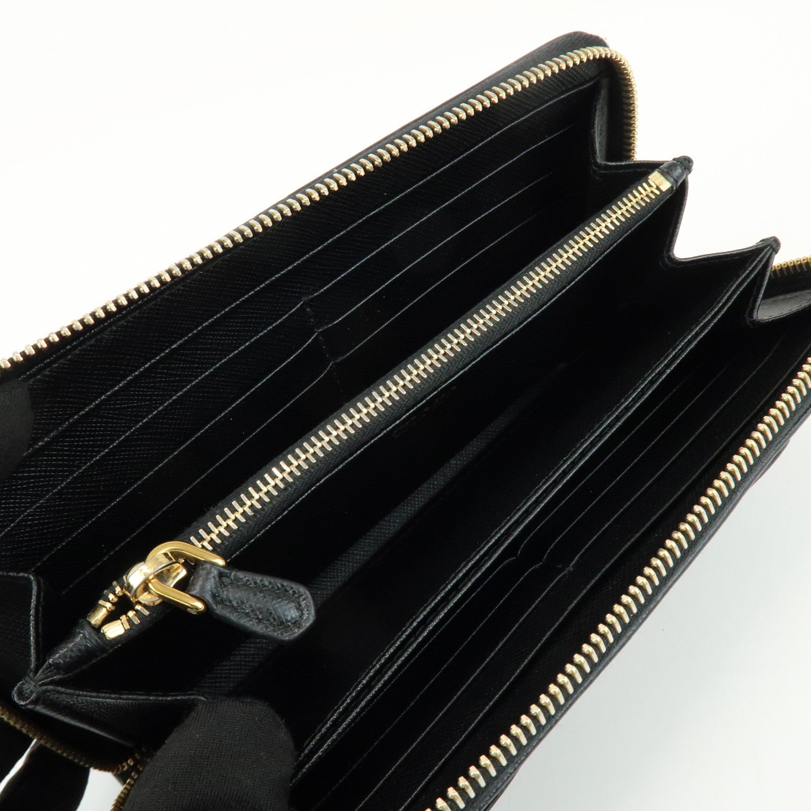 PRADA Saffiano Leather Ribbon Round Zippy Wallet Black 1M0506