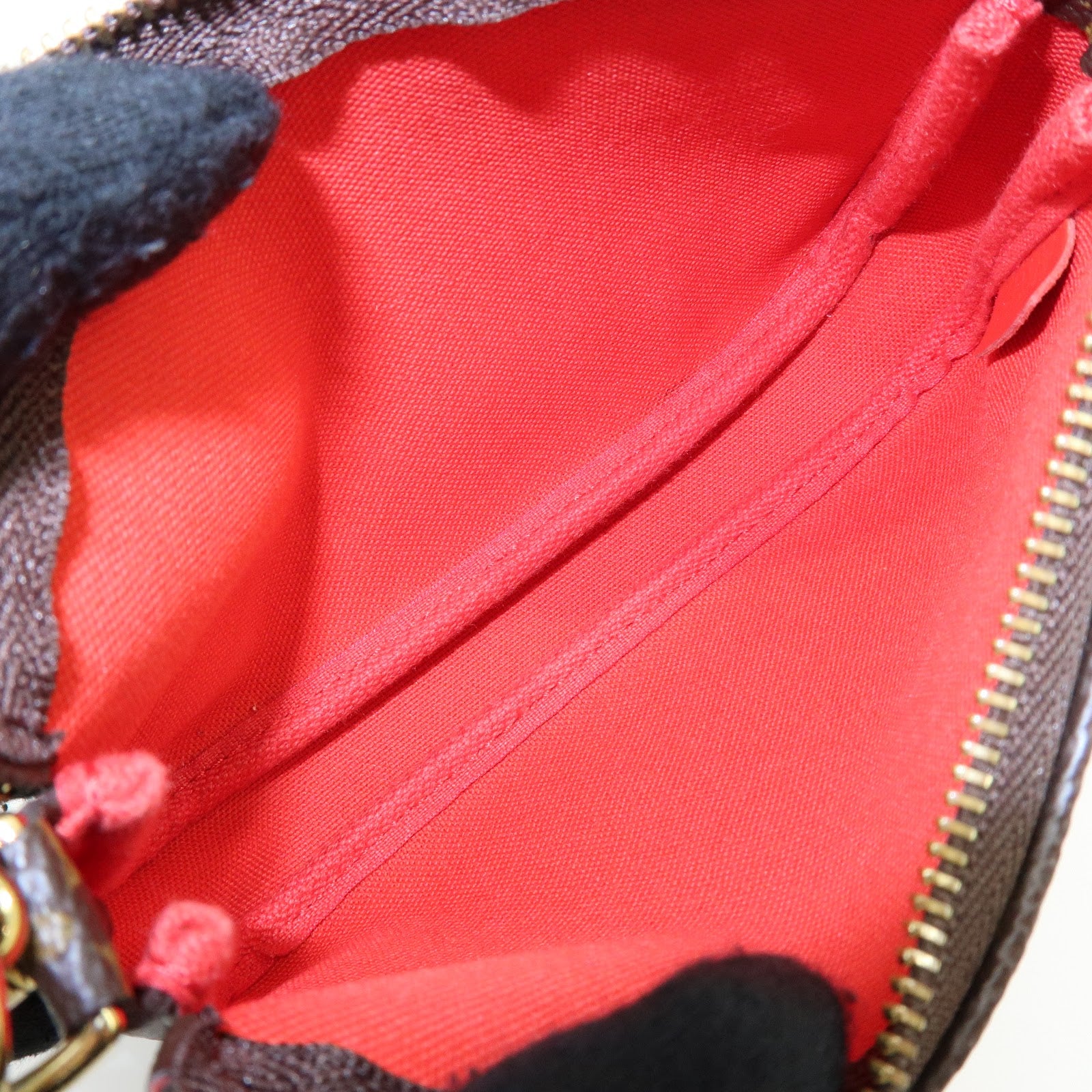 Louis Vuitton Monogram Vivienne Mini Pochette Accessoires M69976