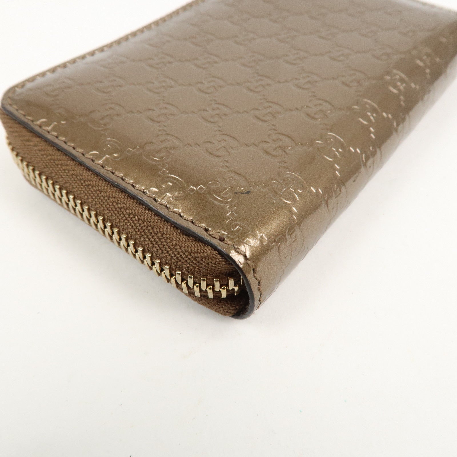 GUCCI Micro Guccissima Leather Zippy Wallet Card Case Bronze 255452