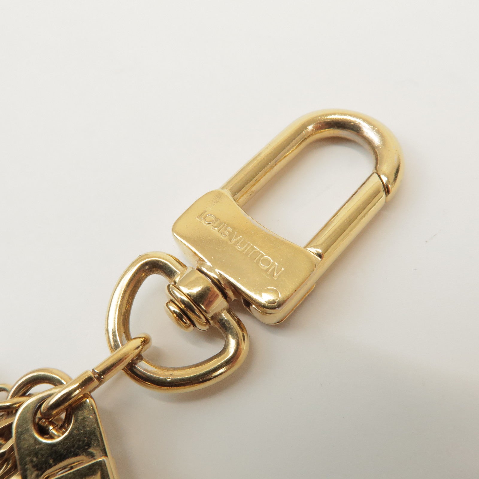 Louis Vuitton Porte Cles Pompille Metal Bag Charm Gold Red M91928