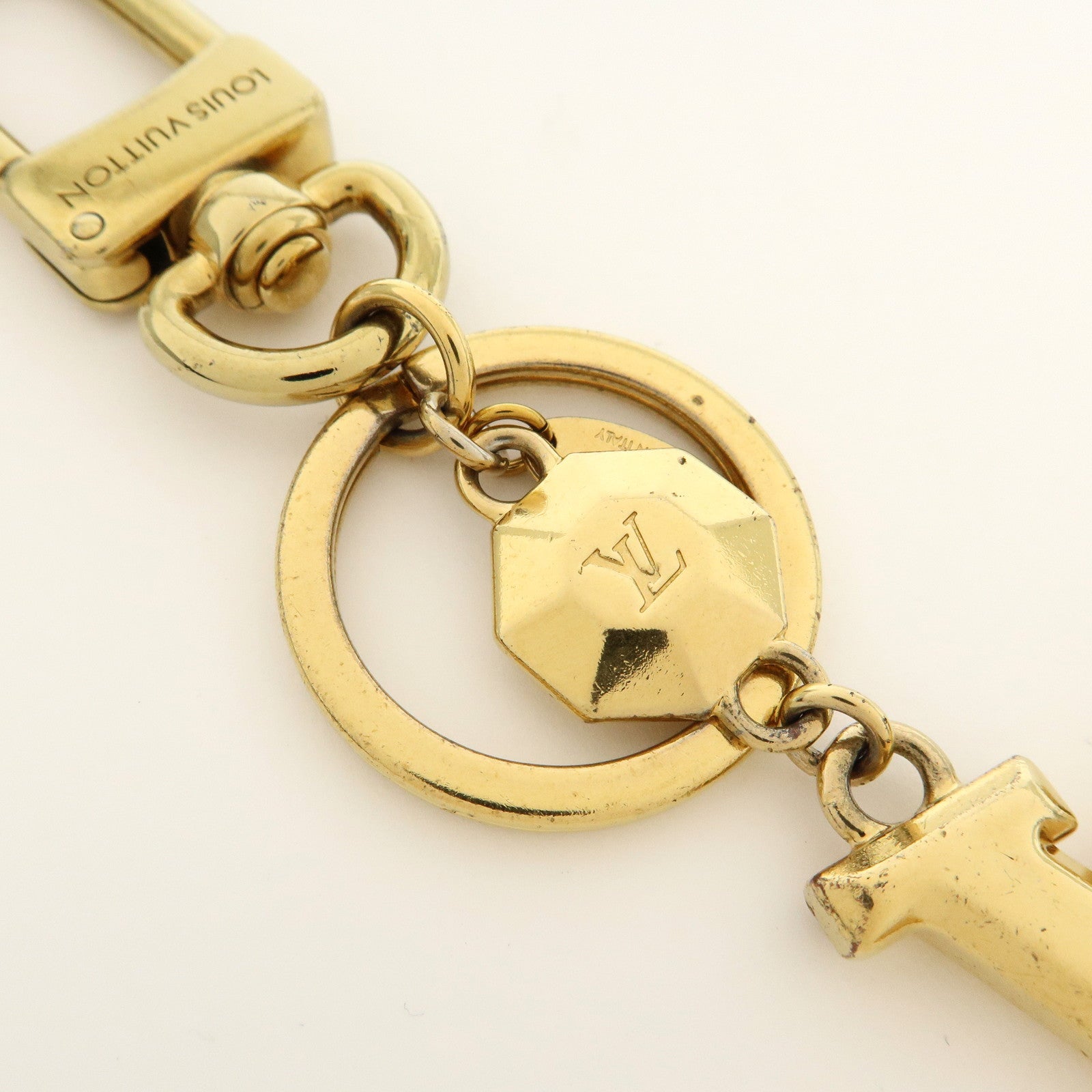Louis Vuitton Porte Cles LV Facettes Metal Bag Charm Gold M65216