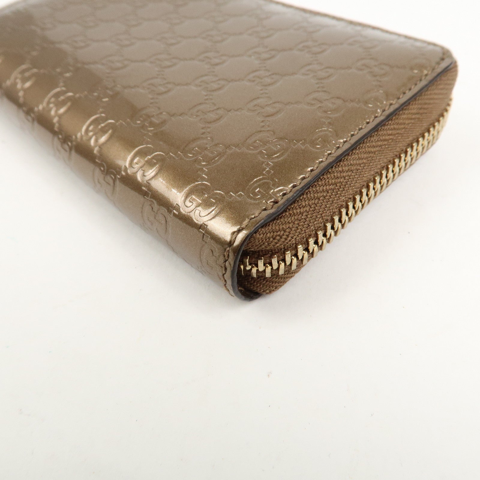 GUCCI Micro Guccissima Leather Zippy Wallet Card Case Bronze 255452