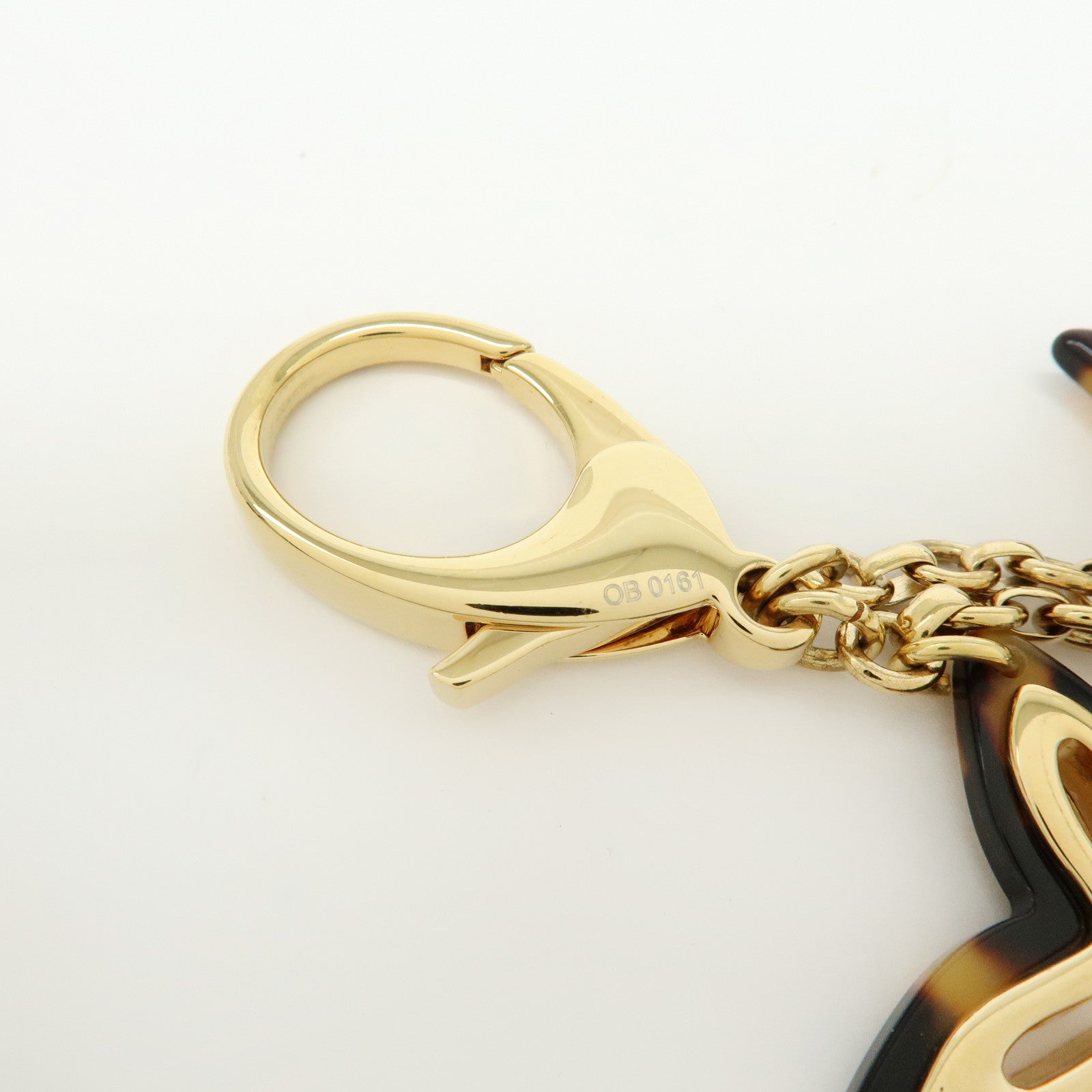 Louis Vuitton Bijou Sac Insolence Bag Charm Gold Brown M65087