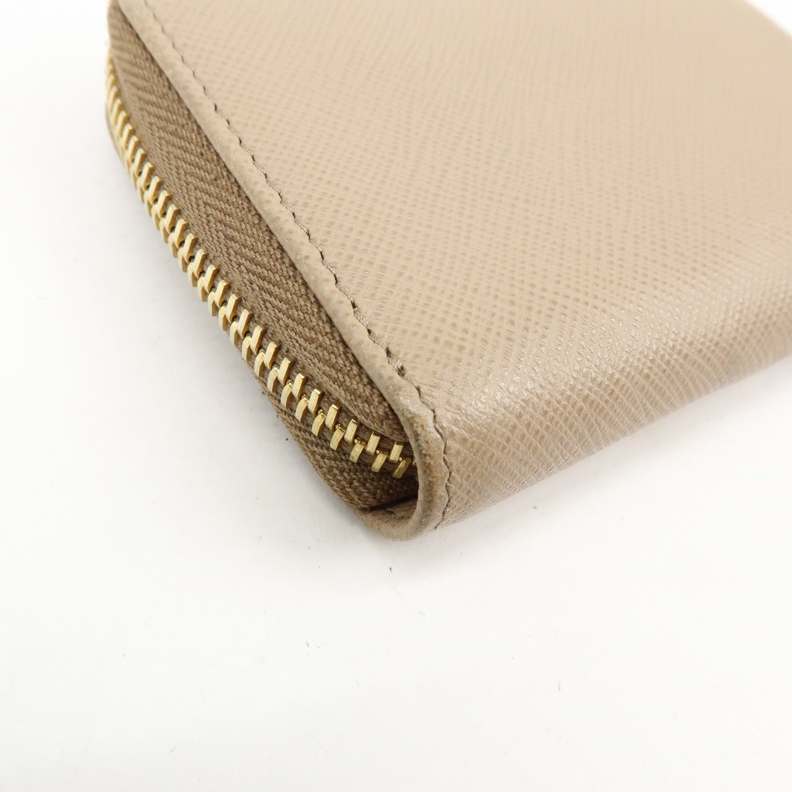 PRADA Triangle Logo Saffiano Leather Round Zippy Compact Wallet