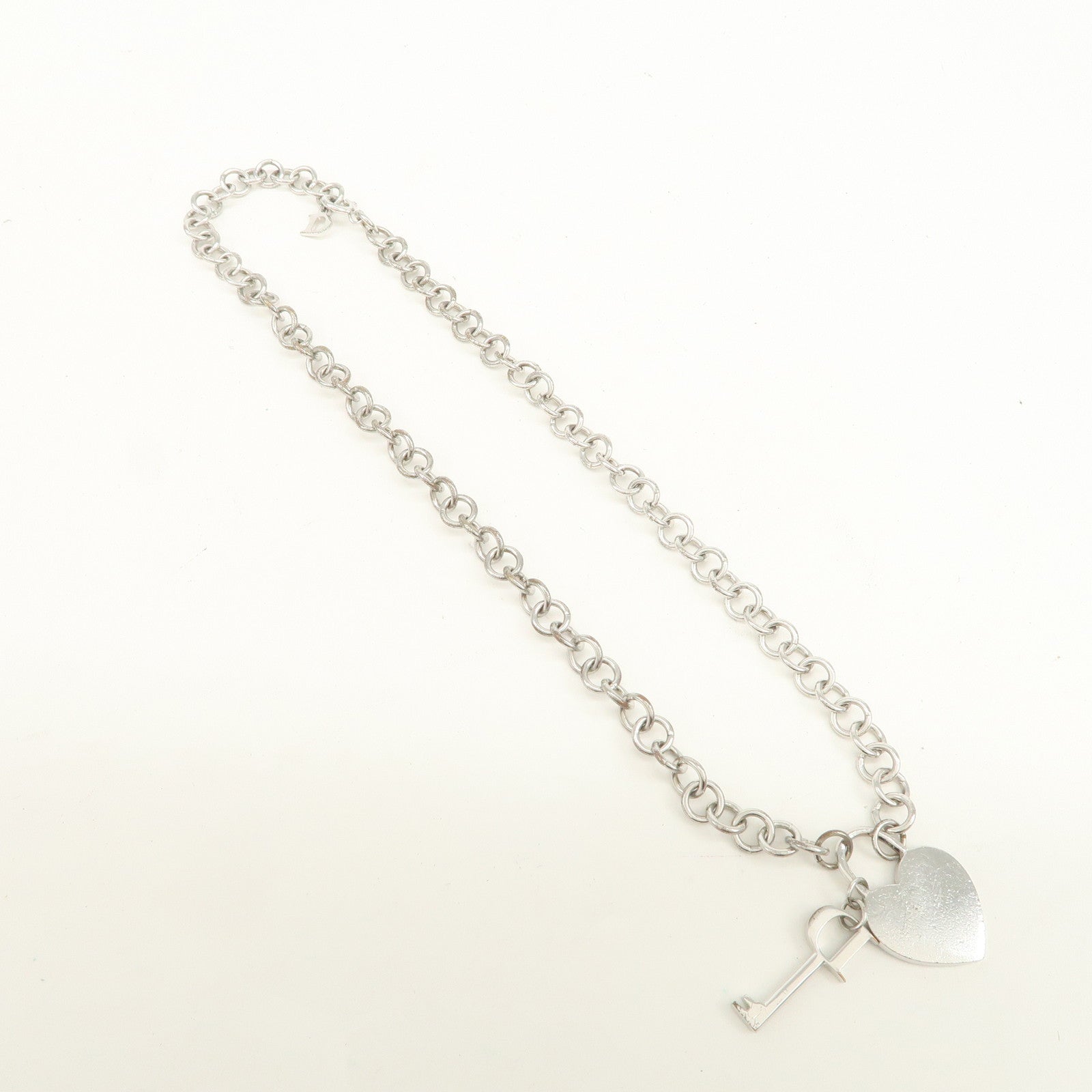 Christian Dior Logo Heart Lock & Key Pendant Metal Necklace Silver
