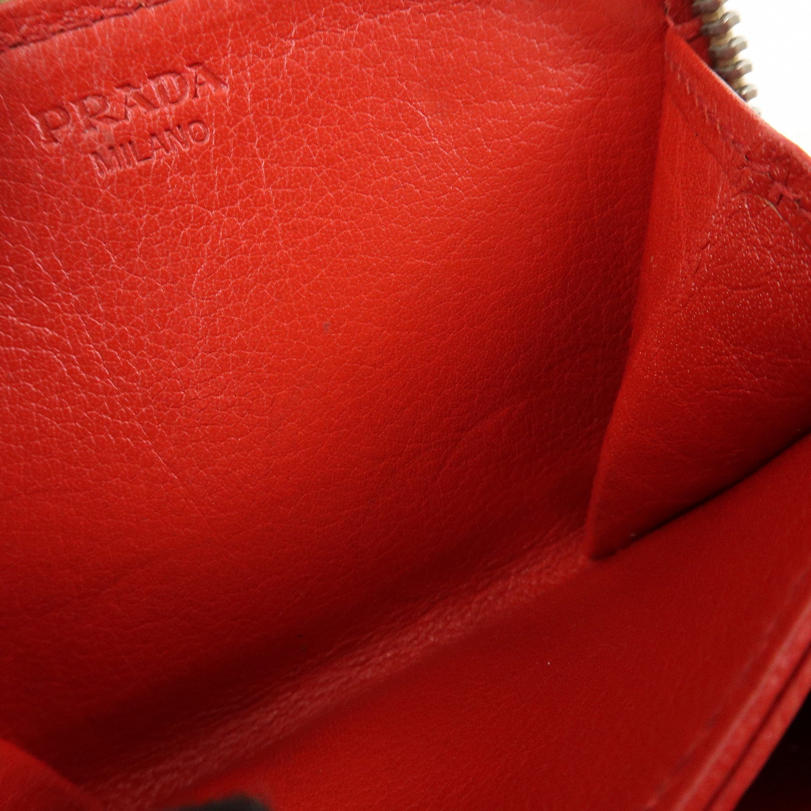 PRADA Triangle Logo Punched Leather Round Zippy Coin Case Red