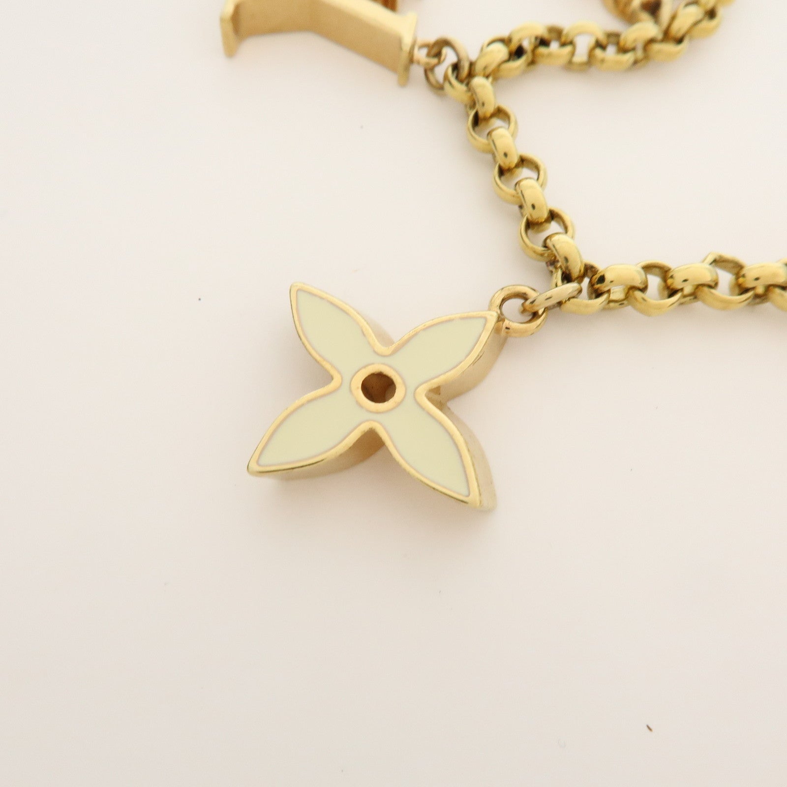 Louis Vuitton Fleur de Monogram Bag Charm Key Chain Gold M65111
