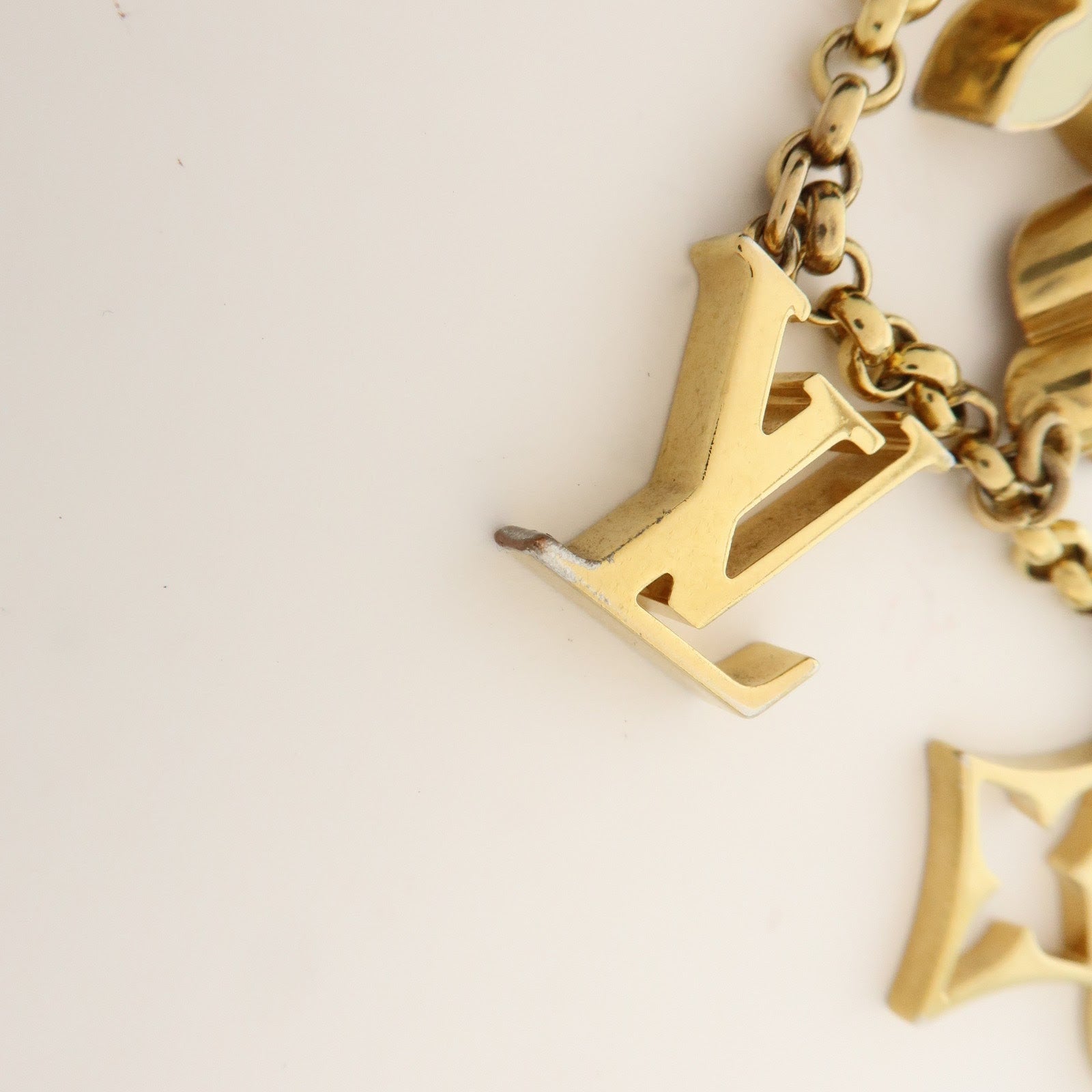 Louis Vuitton Fleur de Monogram Bag Charm Key Chain Gold M65111