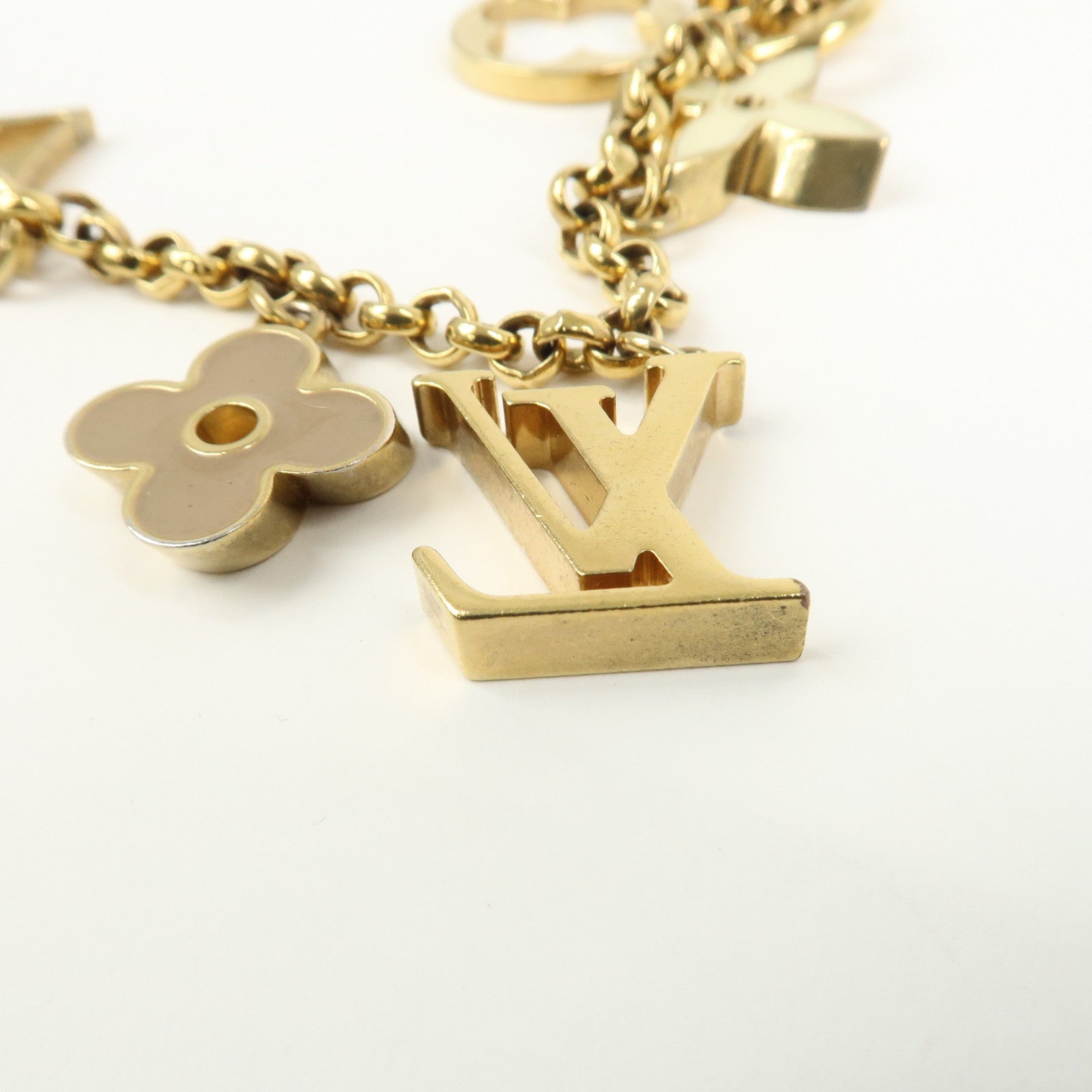 Louis Vuitton Fleur de Monogram Bag Charm Key Chain Gold M65111