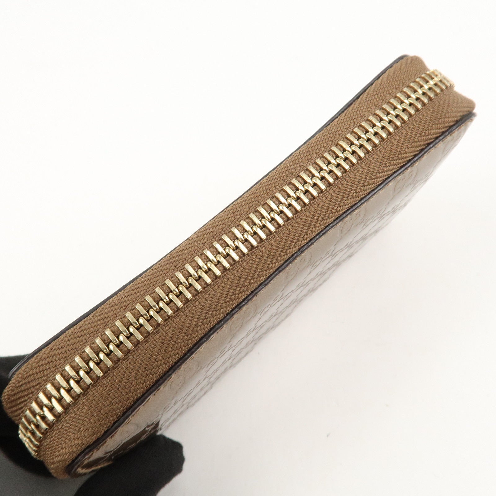 GUCCI Micro Guccissima Leather Zippy Wallet Card Case Bronze 255452