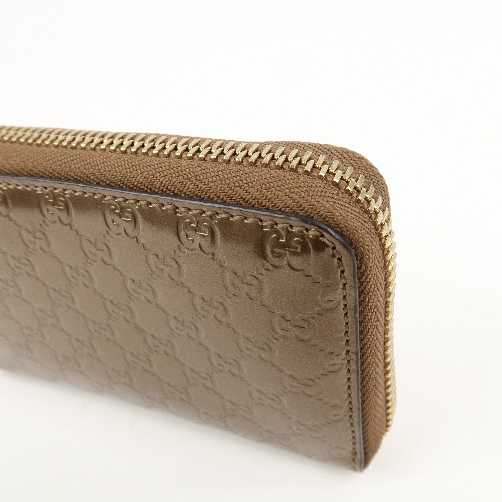 GUCCI Micro Guccissima Leather Zippy Wallet Card Case Bronze 255452
