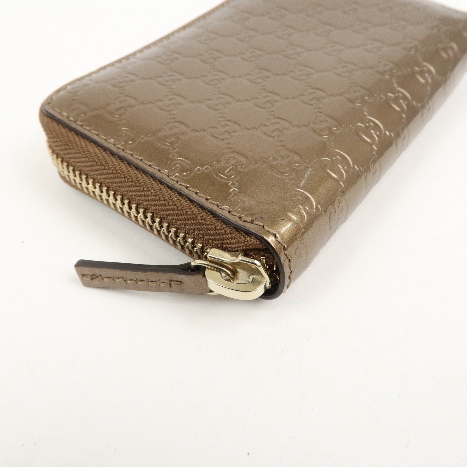 GUCCI Micro Guccissima Leather Zippy Wallet Card Case Bronze 255452