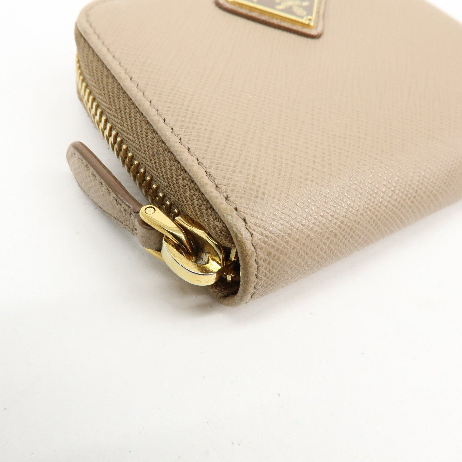 PRADA Triangle Logo Saffiano Leather Round Zippy Compact Wallet