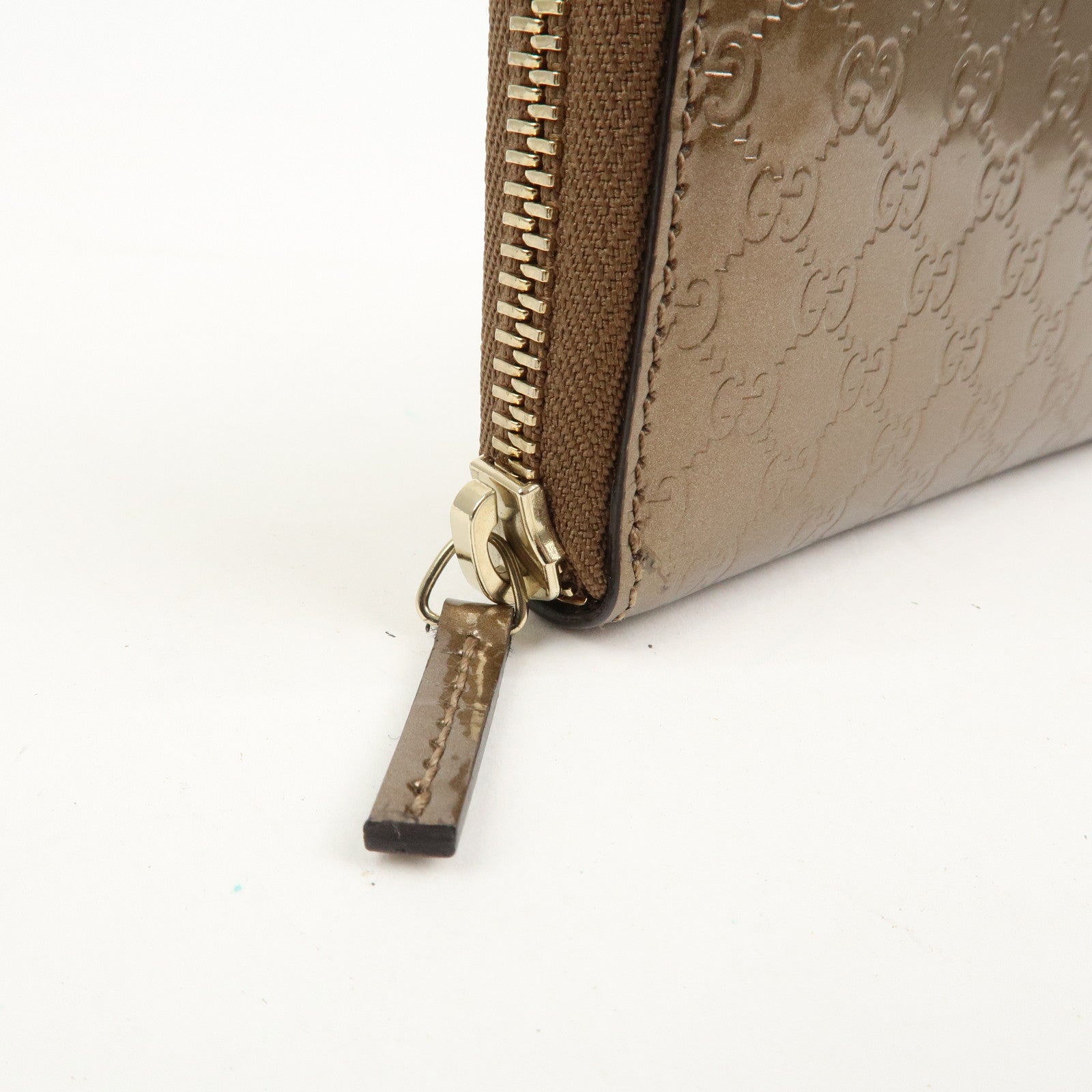 GUCCI Micro Guccissima Leather Zippy Wallet Card Case Bronze 255452