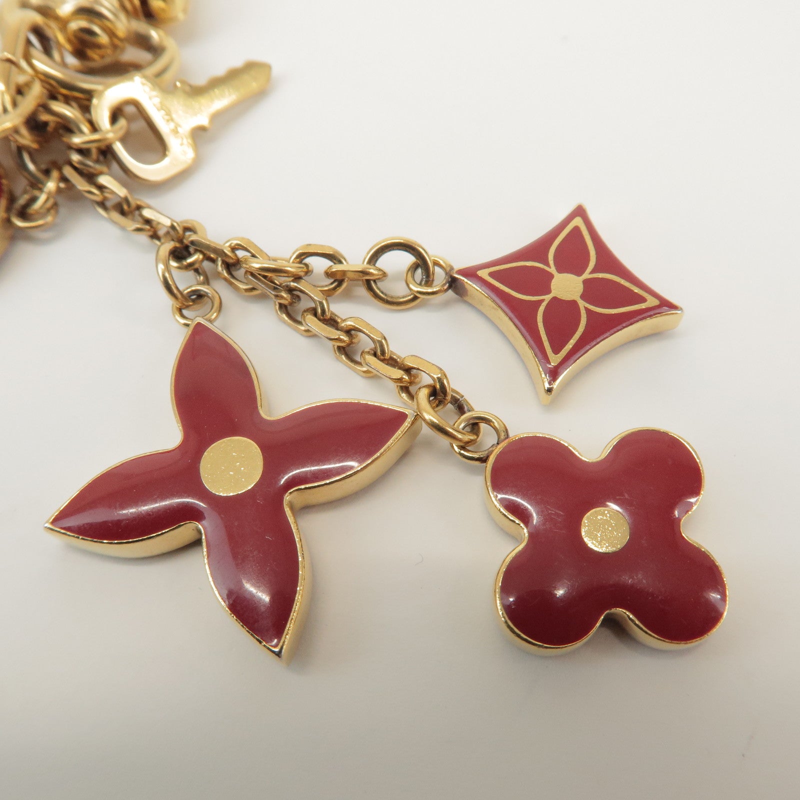 Louis Vuitton Porte Cles Pompille Metal Bag Charm Gold Red M91928