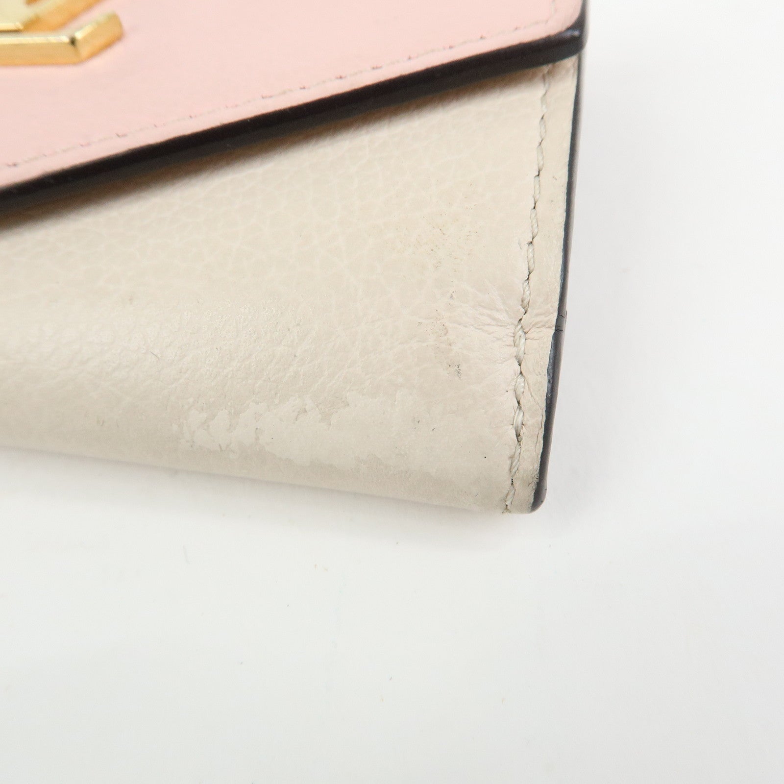 Louis Vuitton Portefeuille Lockmini Taurillon Compact Wallet M80785