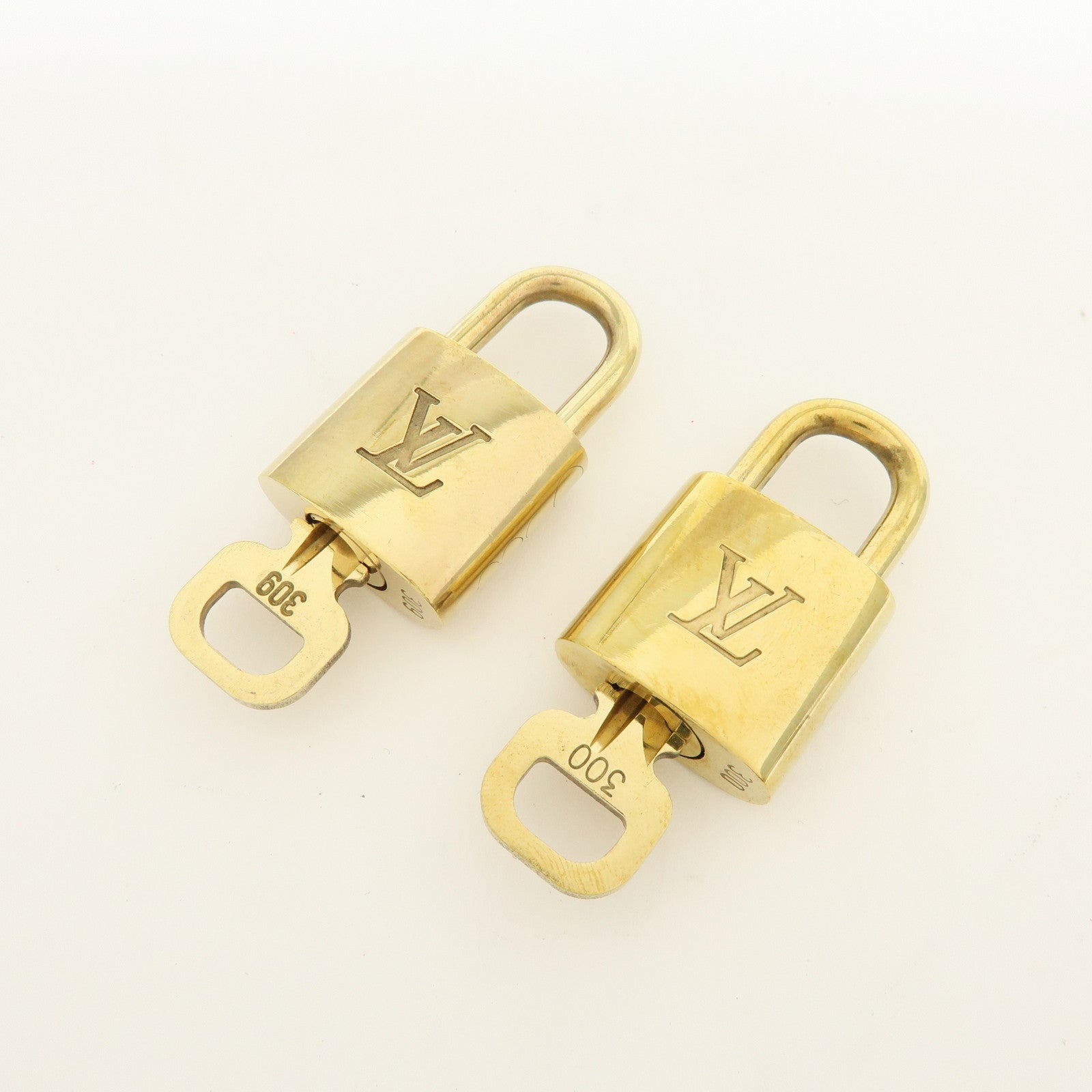 Louis Vuitton Lot of 10 Metal Lock & Key Cadena Key Lock Gold