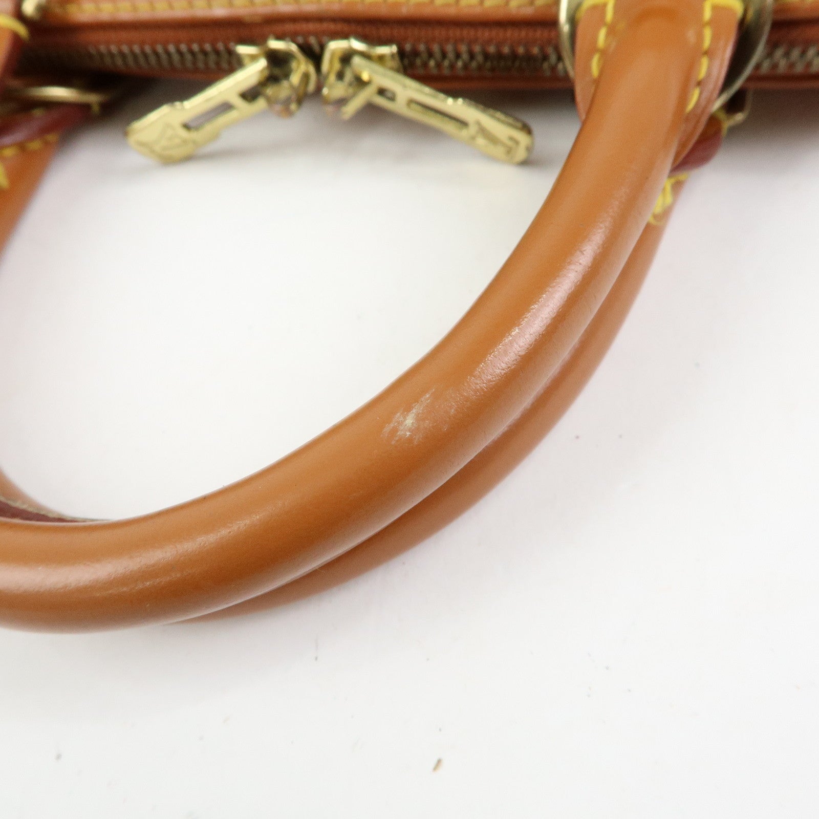 Louis Vuitton Epi Alma PM Leather Hand Bag Zipang Gold M52148