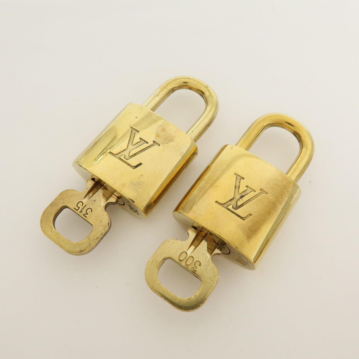 Louis Vuitton Lot of 10 Metal Lock & Key Cadena Key Lock Gold